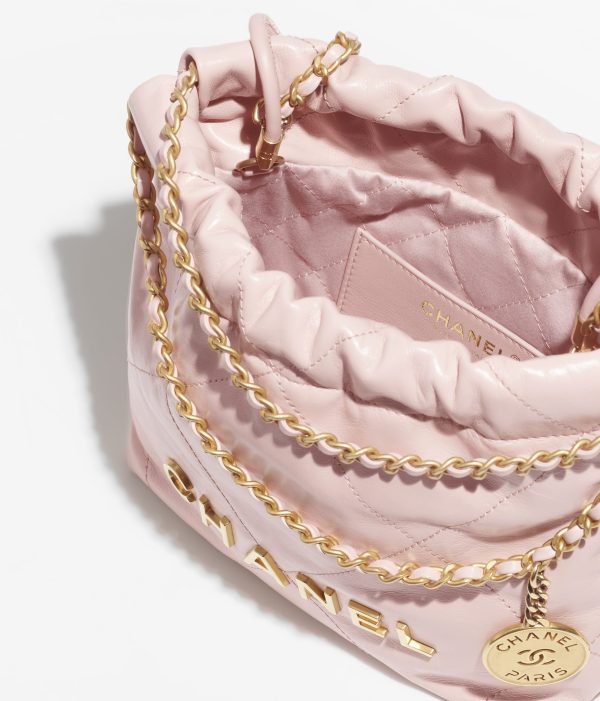 CHANEL 22 MINI HANDBAG Shiny Calfskin & Gold-Tone Metal Light Pink