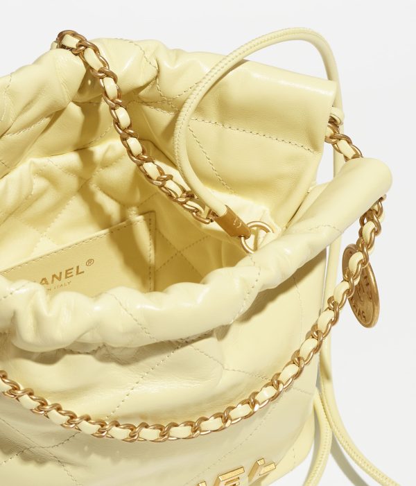 CHANEL 22 MINI HANDBAG Shiny Calfskin & Gold-Tone Metal Light Yellow