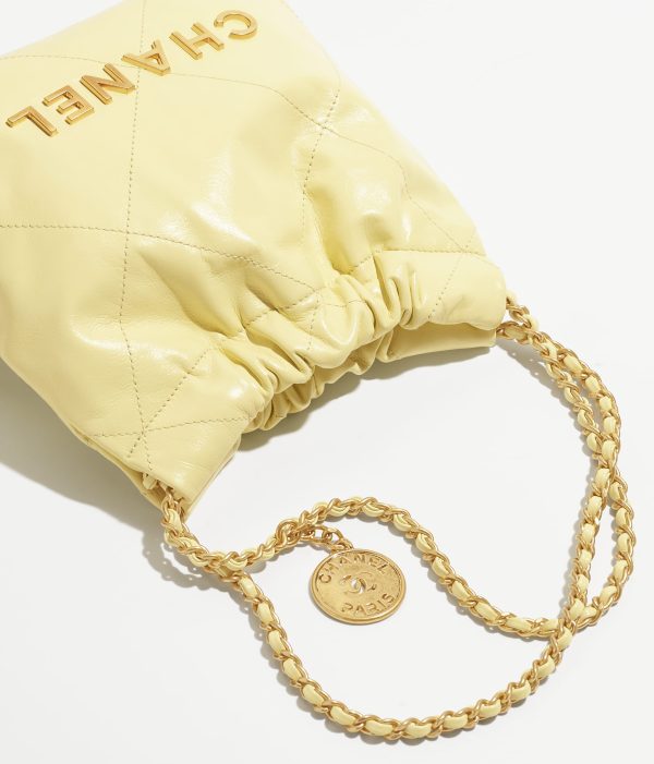 CHANEL 22 MINI HANDBAG Shiny Calfskin & Gold-Tone Metal Light Yellow