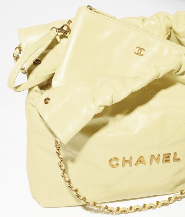 CHANEL 22 SMALL HANDBAG Calfskin & Silver Metal Yellow