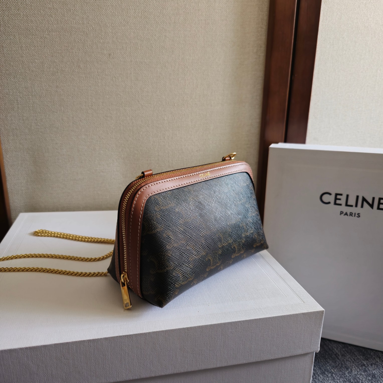 Clutch with Chain in Triomphe canvas and Lambskin - Image 1